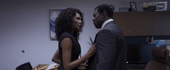 Movie still from “Acrimony” (2018), directed by Tyler Perry – A man and a woman standing next to each other in a room; Medium shot, Over the shoulder angle