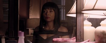 Movie still from “Acrimony” (2018), directed by Tyler Perry – A woman sitting at a table in front of a mirror; Close Up shot, Over the shoulder angle