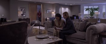 Movie still from “Acrimony” (2018), directed by Tyler Perry – Two women sitting on a couch in a living room; Wide shot, Over the shoulder angle