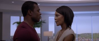 Movie still from “Acrimony” (2018), directed by Tyler Perry – A man and a woman face to face in front of a window; Close Up shot, Over the shoulder angle