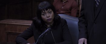 Movie still from “Acrimony” (2018), directed by Tyler Perry – A woman sitting in front of microphones in a room; Close Up shot, Over the shoulder angle
