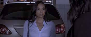 Movie still from “Acrimony” (2018), directed by Tyler Perry – A woman standing next to a car in a parking lot; Close Up shot, Over the shoulder angle