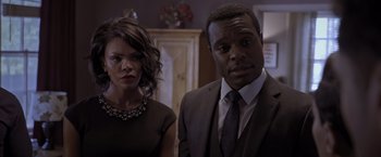 Movie still from “Acrimony” (2018), directed by Tyler Perry – A man and a woman standing next to each other in a room; Close Up shot, Over the shoulder angle