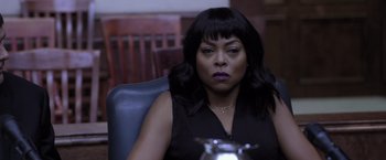 Movie still from “Acrimony” (2018), directed by Tyler Perry – A woman sitting in a leather chair; Close Up shot, Over the shoulder angle