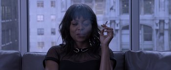 Movie still from “Acrimony” (2018), directed by Tyler Perry – A woman holding a cigarette in her mouth; Close Up shot, Overhead angle