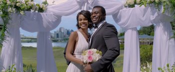 Movie still from “Acrimony” (2018), directed by Tyler Perry – A man and a woman posing in front of a city skyline; Medium shot, High angle