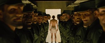 Movie still from “Across the Universe” (2007), directed by Julie Taymor – A group of men standing next to each other; Wide shot, Low angle