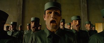 Movie still from “Across the Universe” (2007), directed by Julie Taymor – A group of men standing next to each other; Close Up shot, Low angle