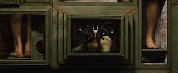 Movie still from “Across the Universe” (2007), directed by Julie Taymor – A person looking through a pair of binoculars; Extreme Close Up shot, Overhead angle