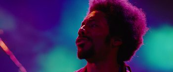 Movie still from “Across the Universe” (2007), directed by Julie Taymor – A person with a beard; Close Up shot, Low angle