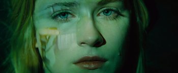 Movie still from “Across the Universe” (2007), directed by Julie Taymor – A woman's face with tears coming out of her eyes; Extreme Close Up shot, Overhead angle