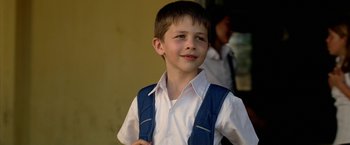 Movie still from “Act of Valor” (2012), directed by Scott Waugh – A young boy wearing a white shirt and blue vest; Close Up shot, Low angle