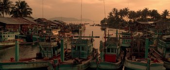 Movie still from “Act of Valor” (2012), directed by Scott Waugh – A group of boats in a body of water near palm trees; Extreme Wide shot, High angle