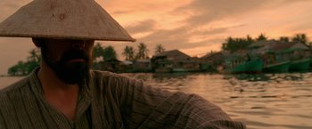 Movie still from “Act of Valor” (2012), directed by Scott Waugh – A person sitting on a raft in the water; Close Up shot, Over the shoulder angle