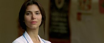 Movie still from “Act of Valor” (2012), directed by Scott Waugh – A person wearing a white shirt; Close Up shot, Low angle