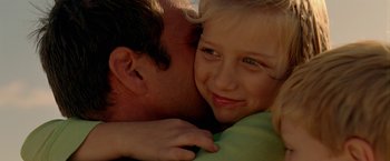 Movie still from “Act of Valor” (2012), directed by Scott Waugh – A man and a woman are hugging each other; Close Up shot, Over the shoulder angle