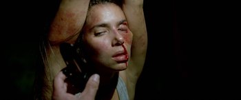 Movie still from “Act of Valor” (2012), directed by Scott Waugh – A woman with blood all over her face and neck; Close Up shot, Overhead angle