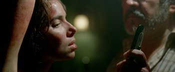 Movie still from “Act of Valor” (2012), directed by Scott Waugh – A woman's face in front of a mirror; Extreme Close Up shot, Over the shoulder angle