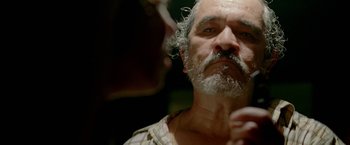 Movie still from “Act of Valor” (2012), directed by Scott Waugh – An older man with a beard and mustache; Close Up shot, Low angle