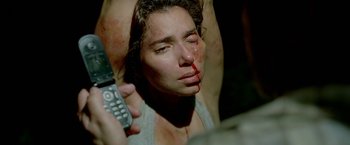 Movie still from “Act of Valor” (2012), directed by Scott Waugh – A woman is holding a cell phone in her hand; Close Up shot, Overhead angle