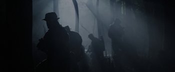 Movie still from “Act of Valor” (2012), directed by Scott Waugh – A group of people standing in the dark; Wide shot, Low angle