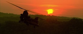 Movie still from “Act of Valor” (2012), directed by Scott Waugh – A helicopter flying in the air at sunset; Extreme Wide shot, Low angle