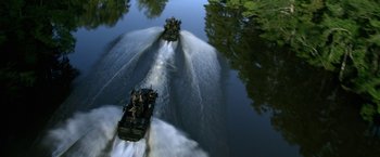 Movie still from “Act of Valor” (2012), directed by Scott Waugh – A group of people on a boat in a body of water; Extreme Wide shot, High angle
