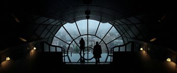Movie still from “Act of Valor” (2012), directed by Scott Waugh – Two people standing in front of a large window; Wide shot, Low angle