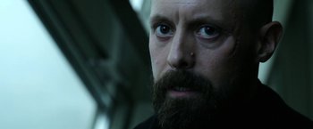 Movie still from “Act of Valor” (2012), directed by Scott Waugh – A person with a beard; Close Up shot, Low angle