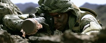 Movie still from “Act of Valor” (2012), directed by Scott Waugh – A soldier is taking a picture with a camera; Extreme Close Up shot, High angle