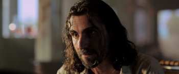 Movie still from “Act of Valor” (2012), directed by Scott Waugh – A person with long hair and a beard; Close Up shot, Low angle