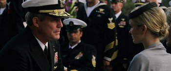 Movie still from “Act of Valor” (2012), directed by Scott Waugh – A group of men in military uniforms standing next to each other; Close Up shot, Over the shoulder angle