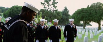Movie still from “Act of Valor” (2012), directed by Scott Waugh – A group of men standing next to each other in uniform; Medium shot, Low angle