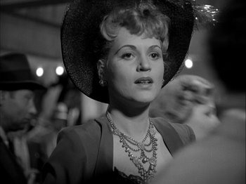 Movie still from “Adam's Rib” (1949), directed by George Cukor – A black and white photo of a woman wearing a hat; Close Up shot, Over the shoulder angle