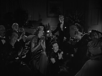 Movie still from “Adam's Rib” (1949), directed by George Cukor – A group of people sitting in a living room; Wide shot, High angle
