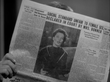 Movie still from “Adam's Rib” (1949), directed by George Cukor – An old photo of a woman in a newspaper; Extreme Close Up shot, High angle