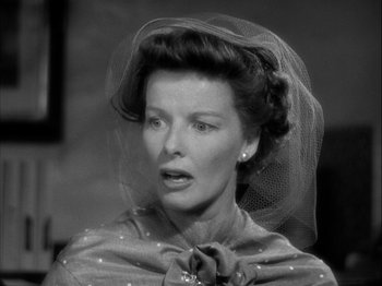Movie still from “Adam's Rib” (1949), directed by George Cukor – An old photo of a woman with a veil on her head; Close Up shot, Low angle