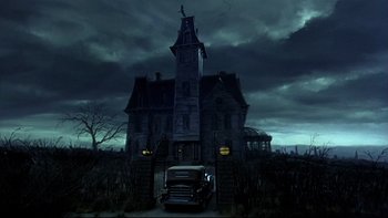 Movie still from “Addams Family Values” (1993), directed by Barry Sonnenfeld – An old truck parked in front of an abandoned house; Wide shot, Low angle