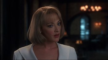 Movie still from “Addams Family Values” (1993), directed by Barry Sonnenfeld – A person with short hair; Close Up shot, Over the shoulder angle