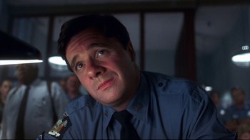 Movie still from “Addams Family Values” (1993), directed by Barry Sonnenfeld – A person wearing a tie; Close Up shot, Low angle