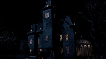 Movie still from “Addams Family Values” (1993), directed by Barry Sonnenfeld – A large building that has been lit up at night; Extreme Wide shot, Low angle