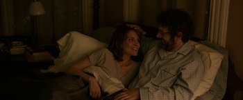 Movie still from “Admission” (2013), directed by Paul Weitz – A man and a woman sitting in a bed; Medium shot, Overhead angle