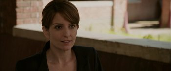 Movie still from “Admission” (2013), directed by Paul Weitz – A person wearing a jacket; Close Up shot, Over the shoulder angle