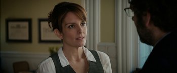 Movie still from “Admission” (2013), directed by Paul Weitz – A person with short brown hair; Close Up shot, Over the shoulder angle