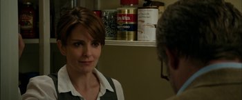 Movie still from “Admission” (2013), directed by Paul Weitz – A woman is looking at a man in a kitchen; Close Up shot, Over the shoulder angle