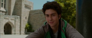 Movie still from “Admission” (2013), directed by Paul Weitz – A person with curly brown hair; Close Up shot, Over the shoulder angle