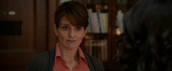 Movie still from “Admission” (2013), directed by Paul Weitz – A person with short hair wearing a jacket; Close Up shot, Over the shoulder angle