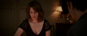 Movie still from “Admission” (2013), directed by Paul Weitz – A woman in a black dress is looking down; Close Up shot, Over the shoulder angle