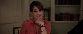 Movie still from “Admission” (2013), directed by Paul Weitz – A person wearing a red shirt; Close Up shot, Over the shoulder angle