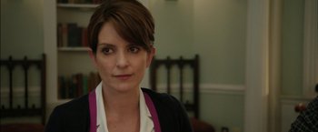 Movie still from “Admission” (2013), directed by Paul Weitz – A person with short brown hair; Close Up shot, Over the shoulder angle